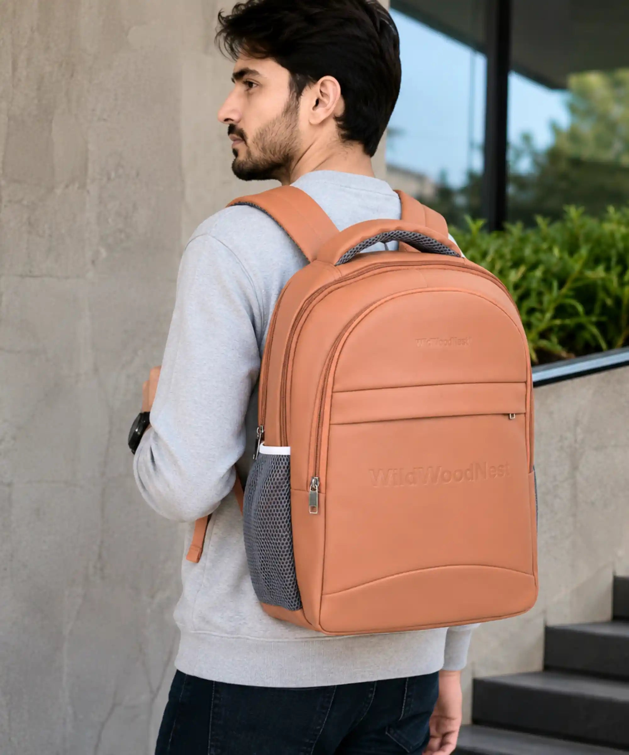 PU leather unisex backpack in tan with padded laptop compartment